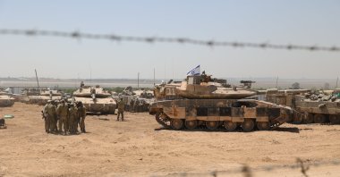 Israeli soldiers with military vehicles gather at an undisclosed position near the border fence with the Gaza Strip, May 9, 2024. (EPA Photo)