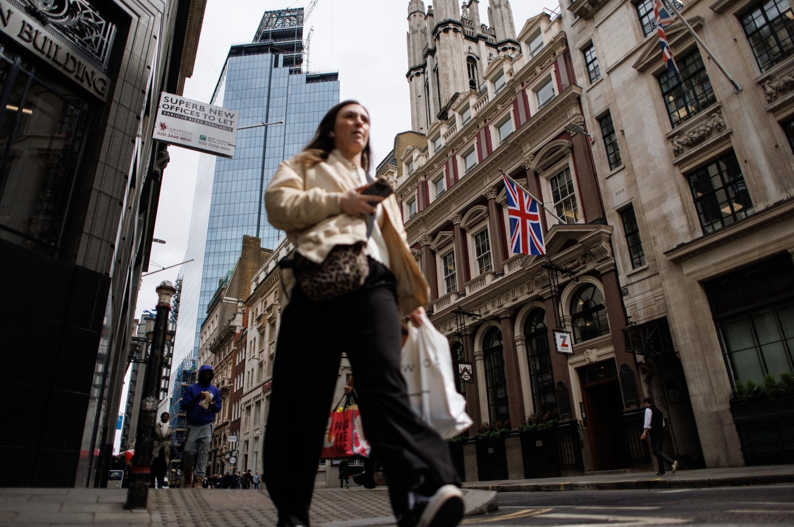 A person walks in the City of London financial district, London, Britain, April 23, 2024. (EPA Photo)