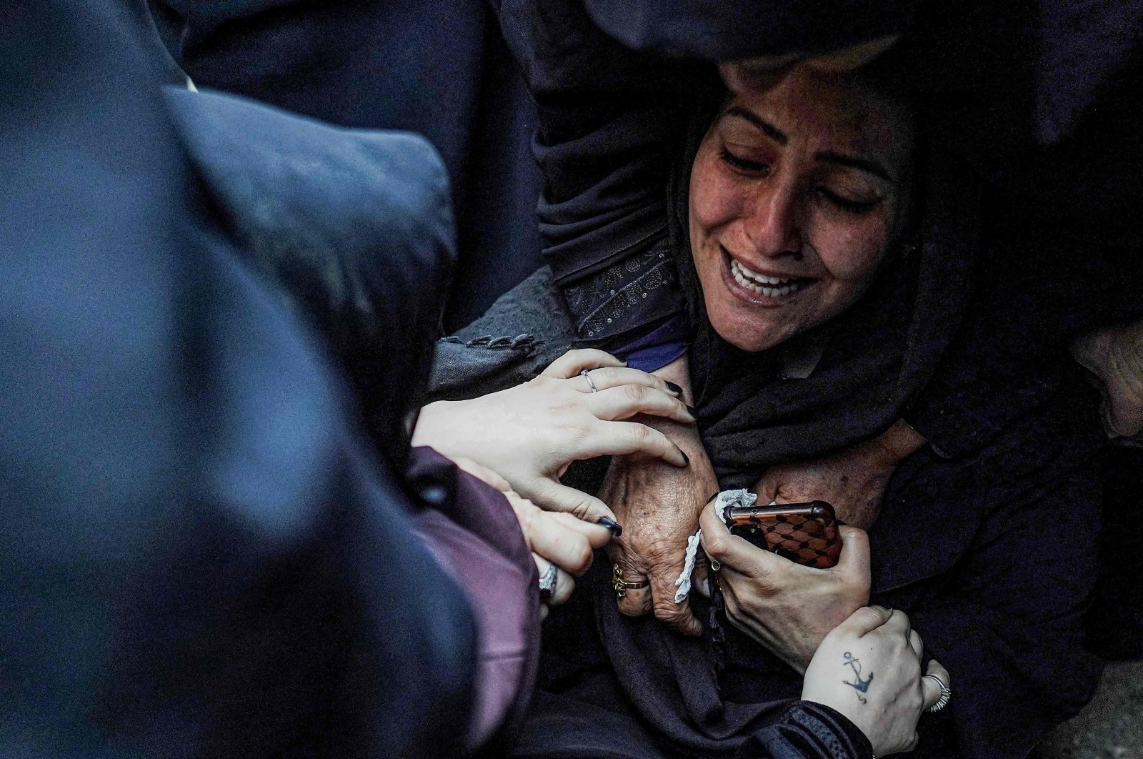 A mother is comforted by other women as she mourns after the recovery of the body of her child from the beneath the rubble of a collapsed building, in Nuseirat, Gaza Strip, Palestine, May 14, 2024. (AFP Photo)