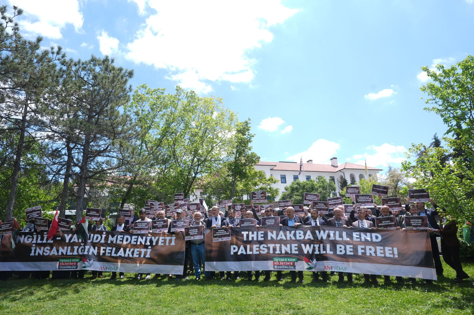 Protestors hold banners that condemn Britain and call for an end to the Israeli-Palestinian conflict at a rally outside the British Embassy in Ankara, Türkiye, May 14, 2024. (AA Photo)