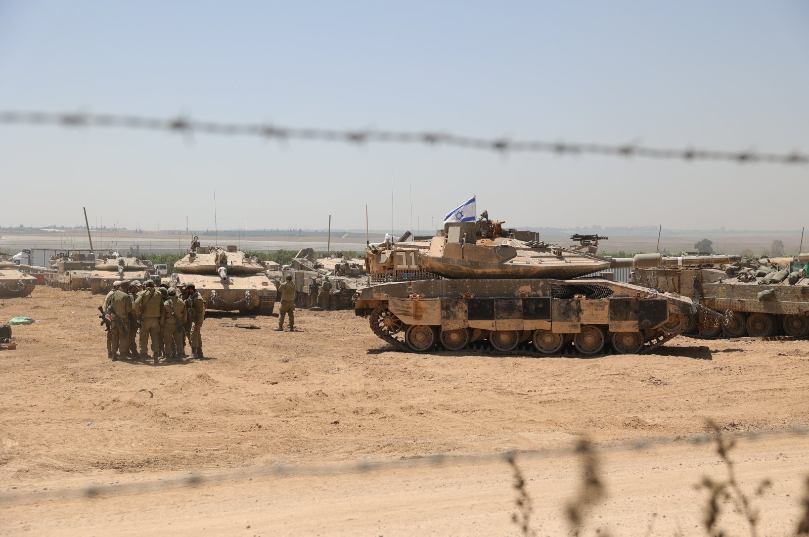 Israeli soldiers with military vehicles gather at an undisclosed position near the border fence with the Gaza Strip, May 9, 2024. (EPA Photo)