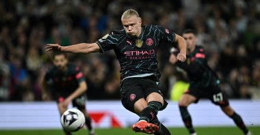 Manchester City's Erling Haaland shoots a penalty kick and scores his team's second goal during the English Premier League football match against Tottenham Hotspur at the Tottenham Hotspur Stadium in London, U.K., May 14, 2024. (AFP Photo)