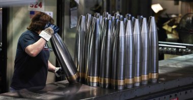 An employee handles 155 mm caliber shells after manufacturing at the Scranton Army Ammunition Plant (SCAAP) in Scranton, Pennsylvania, U.S., April 16, 2024. (AFP Photo)