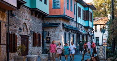 A group of tourists walks in the historic Kaleiçi area of Antalya, southern Türkiye, May 14, 2024. (IHA Photo)