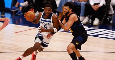 Minnesota Timberwolves guard Anthony Edwards (L) drives to the basket against Denver Nuggets guard Jamal Murray during the third quarter of game five of the Western Conference semifinal series, Denver, Colorado, U.S., May 14, 2024. (EPA Photo)