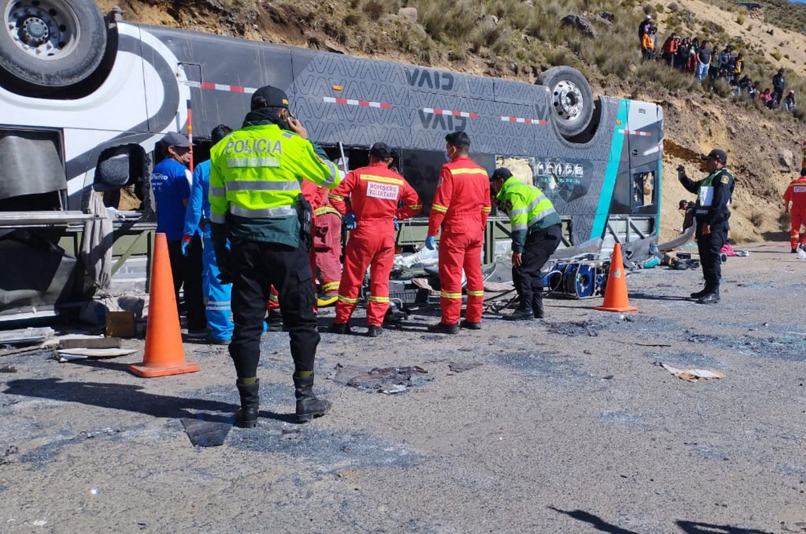 Rescuers inspect the bus crash site in the Ayacucho region, Peru, May 14, 2024. (AFP Photo)