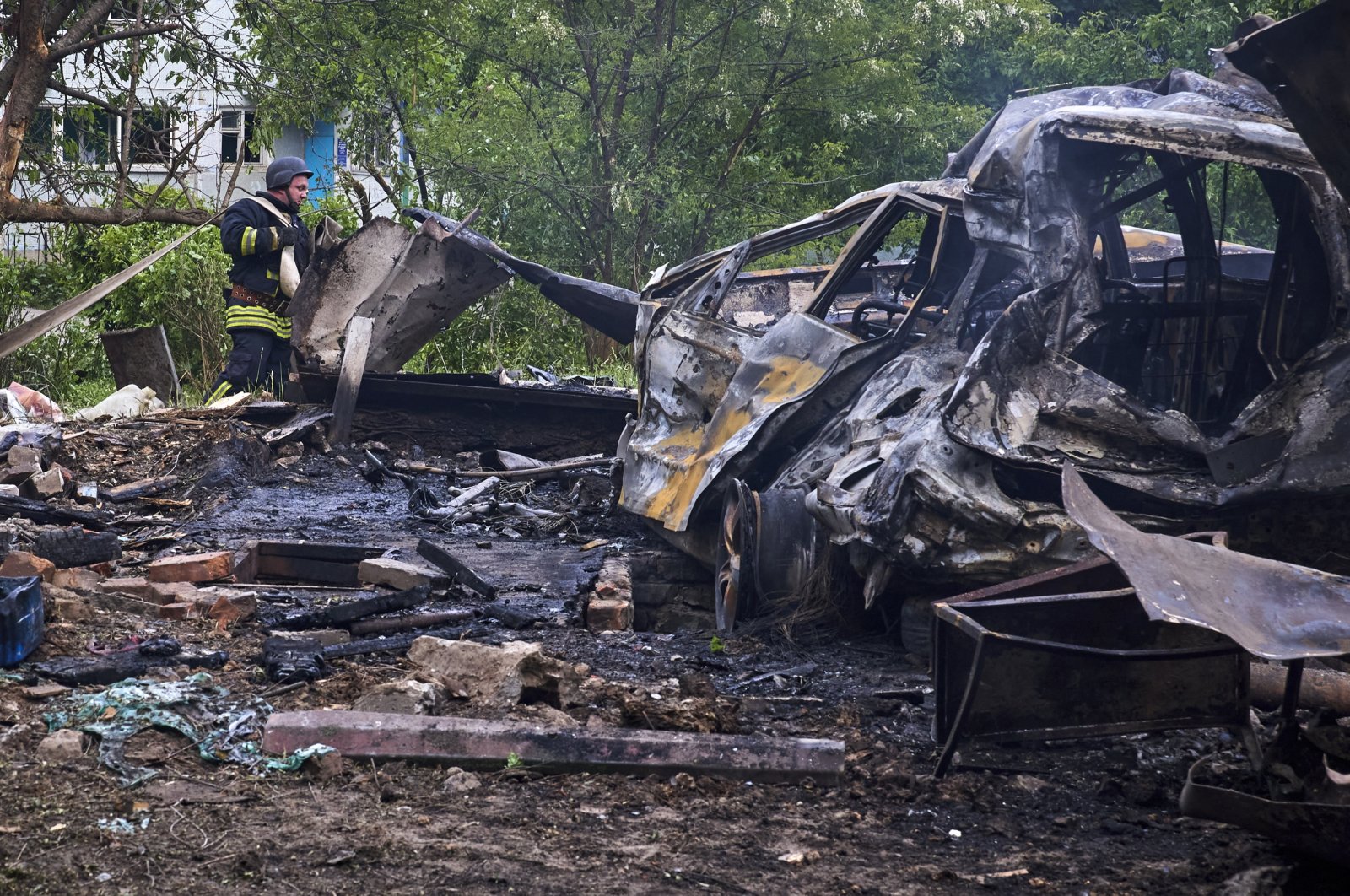 Ukrainian rescuers work at the site of a shelling of a residential area in Kharkiv, Ukraine, May 14, 2024. (EPA Photo)