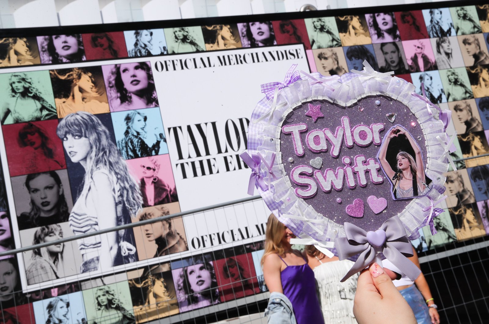 A Taylor Swift fan takes a picture of a handmade sign next to the poster of Taylor Swift&#039;s &quot;Eras Tour&quot; first concert in Europe, at the Paris La Defense Arena, Nanterre, Paris, France, May 9, 2024. (EPA Photo)