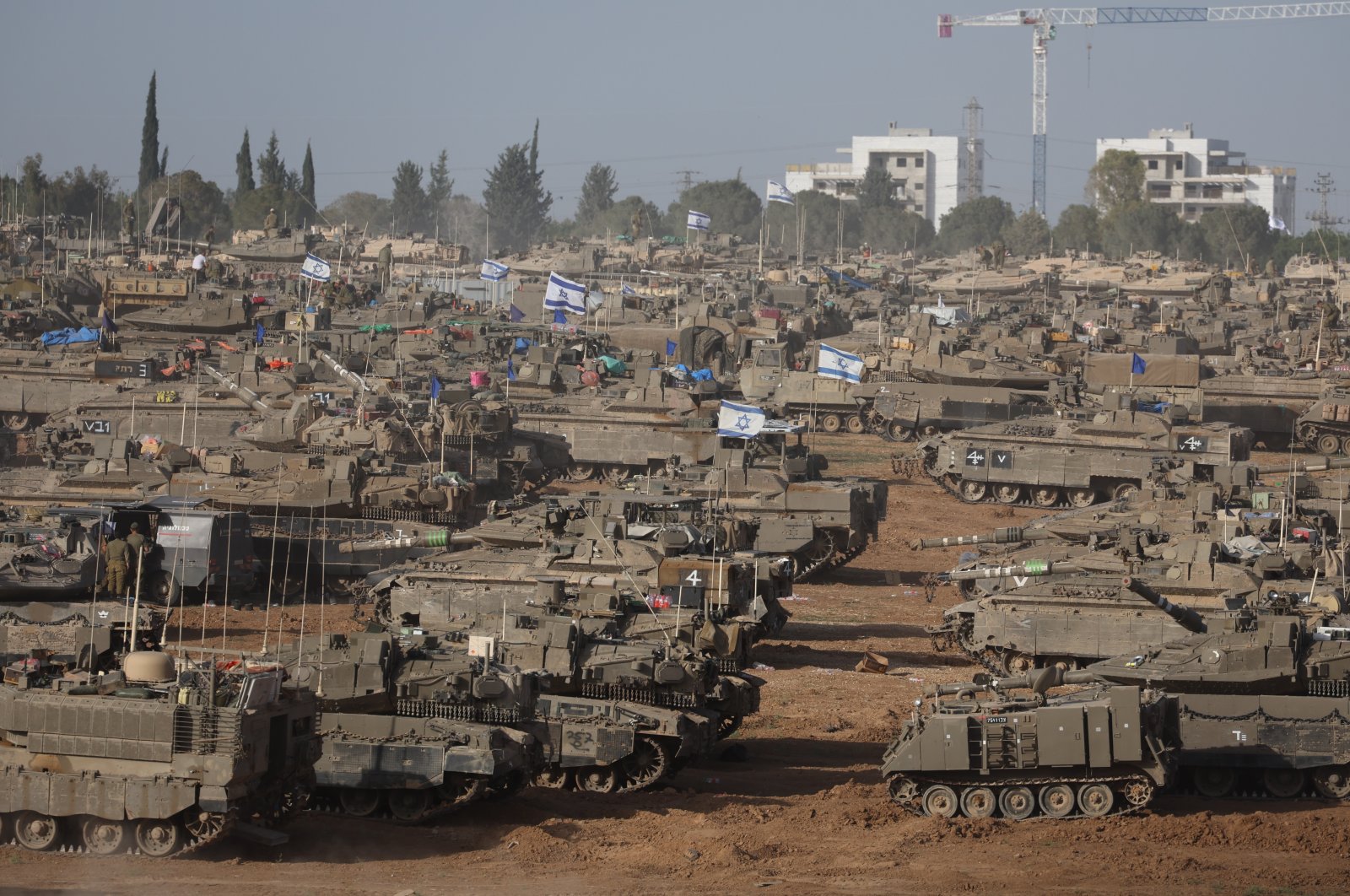 Israeli military vehicles gathered near the border fence with the Gaza Strip, at an undisclosed location in southern Israel, May 9, 2024. (EPA Photo)