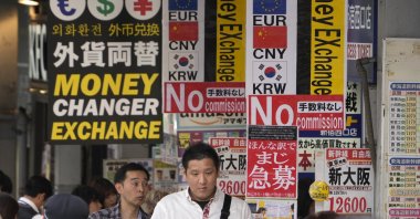 Passersby walk past money changers in Tokyo, Japan, April 30, 2024. (EPA Photo)