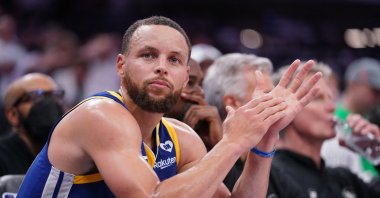 Golden State Warriors guard Stephen Curry sits on the bench during action against the Sacramento Kings in the fourth quarter during a play-in game of the 2024 NBA playoffs at the Golden 1 Center, Sacramento, California, U.S., April 16, 2024. (Reuters Photo)