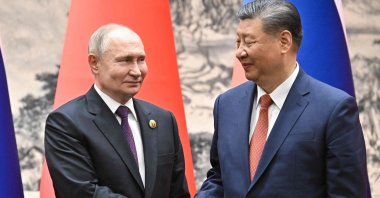 Russia's President Vladimir Putin (L) and China's President Xi Jinping shake hands in Beijing, China, May 16, 2024. (AFP Photo)