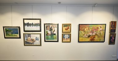 The 44th edition of the Solidarity Association of the Spouses of Foreign Service Members (DMEDD) art exhibition, organized under the theme &quot;Roots and Roads&quot; by the DMEDD, has been inaugurated in Ankara, Türkiye, May 15, 2024. (AA Photo)