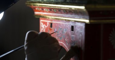 An expert restores a clock from the Topkapı Palace collection, Istanbul, Türkiye, May 16, 2024. (AA Photo)