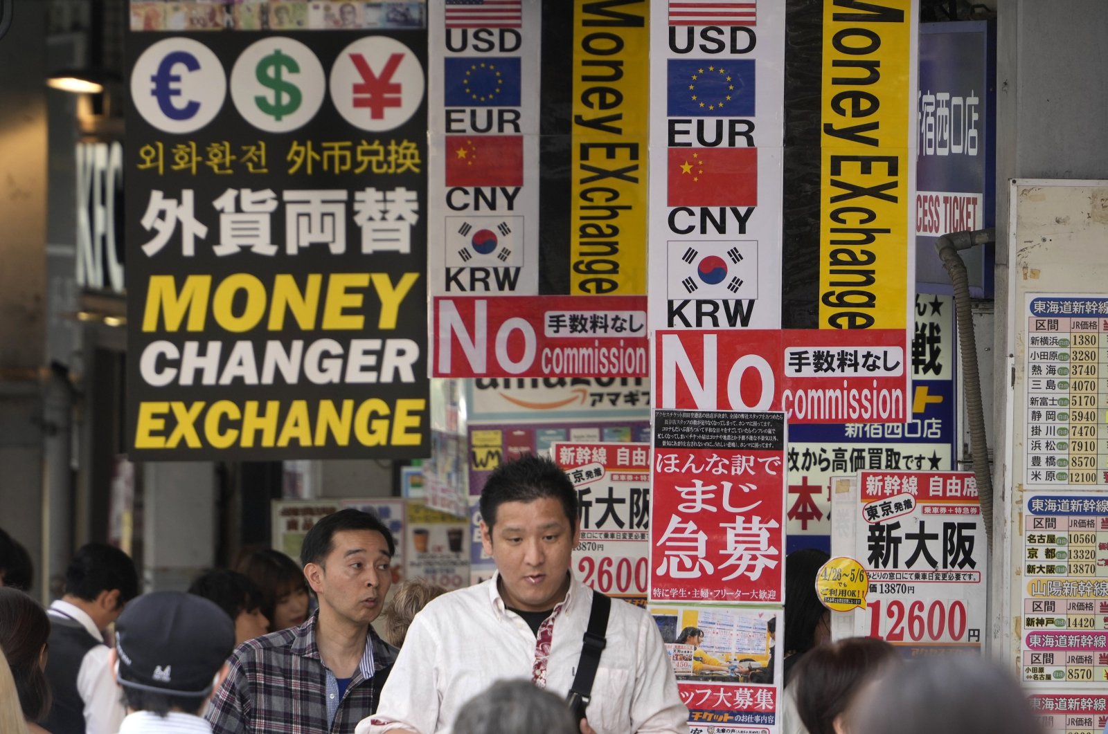 Passersby walk past money changers in Tokyo, Japan, April 30, 2024. (EPA Photo)