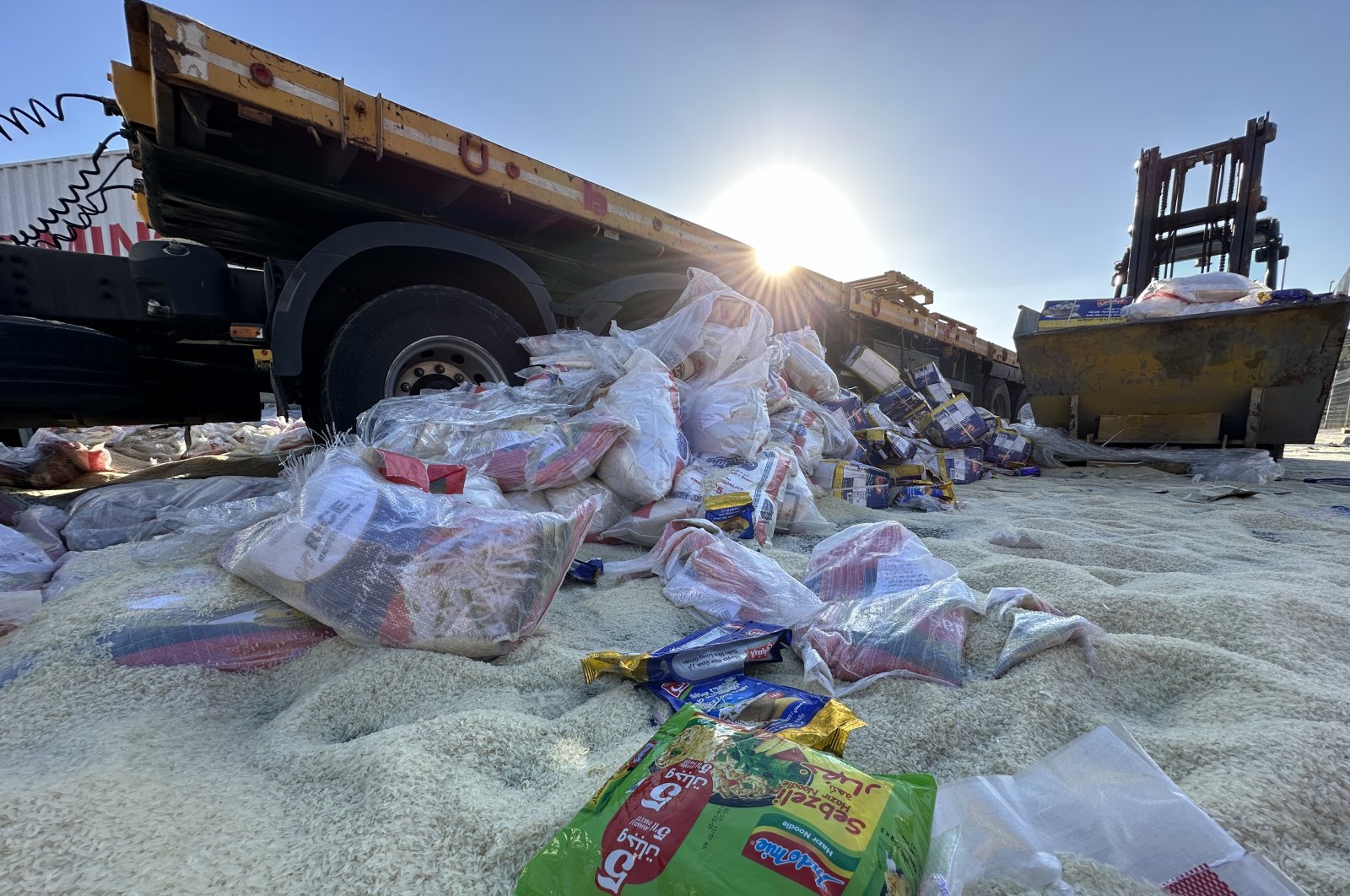 Humanitarian aid supplies dumped by Jewish settlers on a road near Tarqumiyah military checkpoint in Hebron, occupied West Bank, May 13, 2024. (AA Photo)