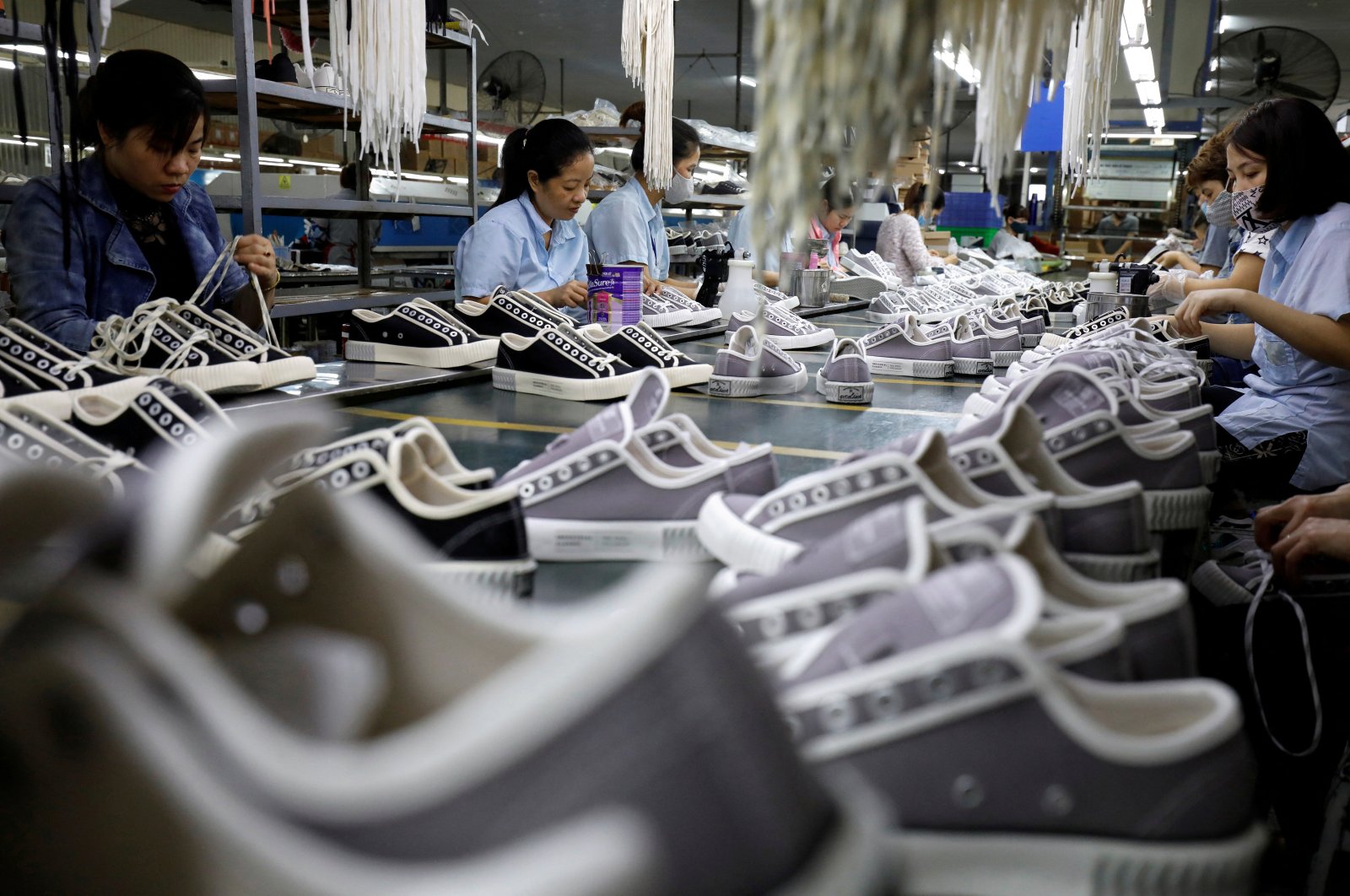 Employees work at a shoe factory for export in Hanoi, Vietnam, Dec. 29, 2020.