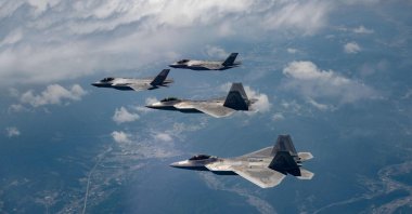 This handout photo provided by the South Korean Defense Ministry shows two U.S. Air Force F-22 fighter jets (front) flying with two South Korean Air Force F-35A fighter jets during a joint air drill in South Korea, May 16, 2024. (AFP Photo)