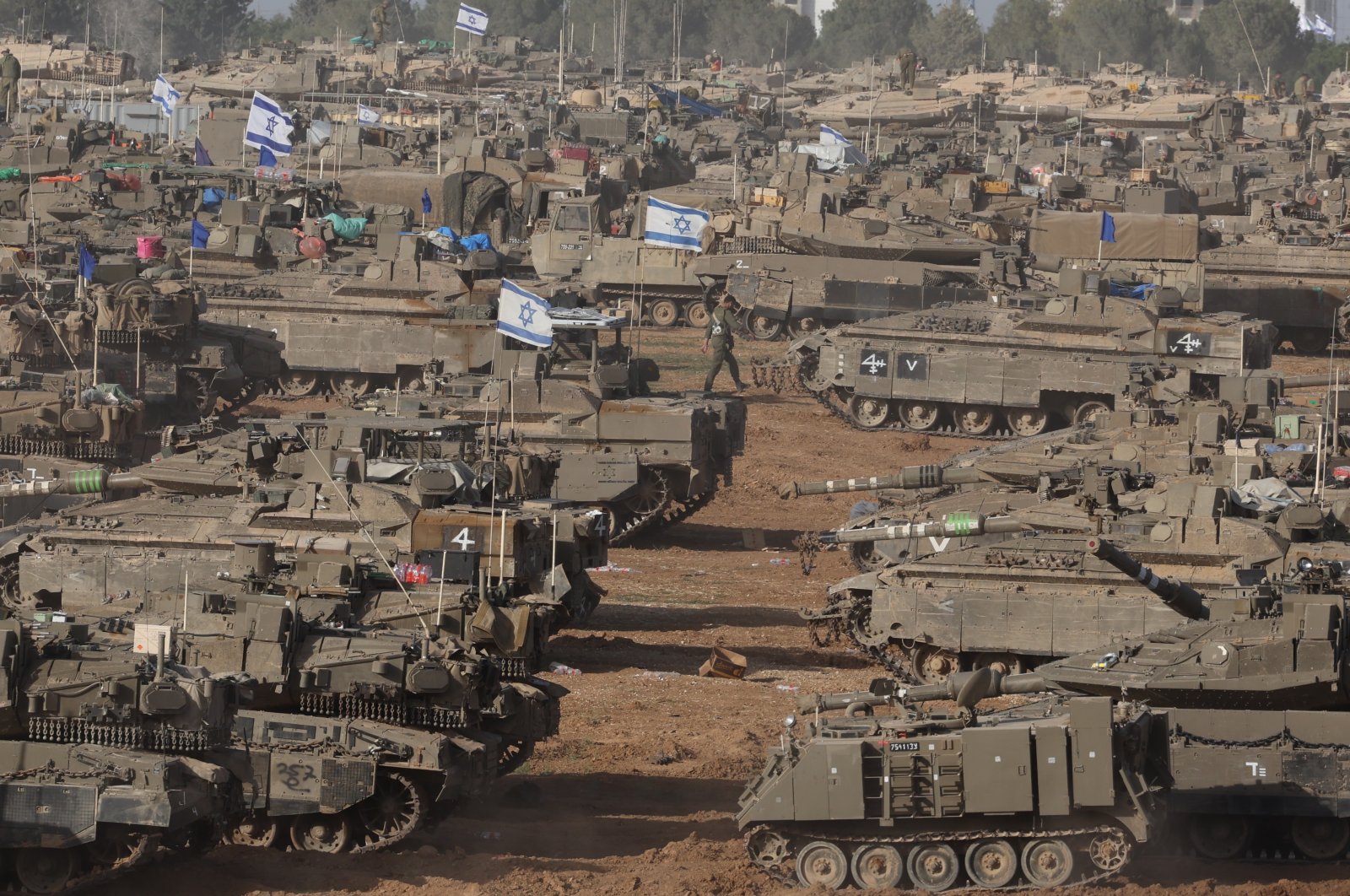 Israeli military vehicles gather near the border fence with the Gaza Strip, at an undisclosed location in southern Israel, May 9, 2024. (EPA Photo)