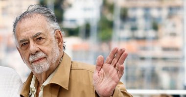 The U.S. director Francis Ford Coppola waves during a photocall for the film &quot;Megalopolis&quot; at the 77th edition of the Cannes Film Festival, Cannes, southern France, May 17, 2024. (AFP Photo)