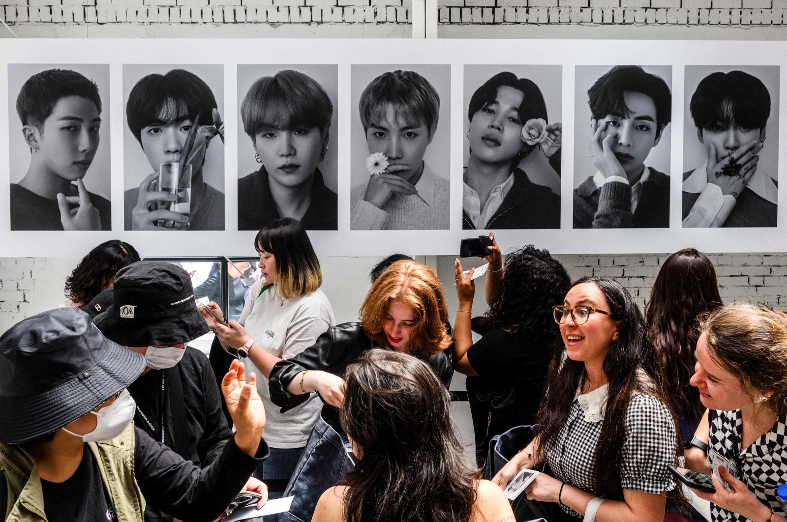 Fans wait to pay for merchandise as they visit a pop-up store that will be open until May 12 of South Korean K-pop sensation BTS entitled &quot;Monochrome,&quot; Seoul, South Korea, April 26, 2024. (AFP Photo)