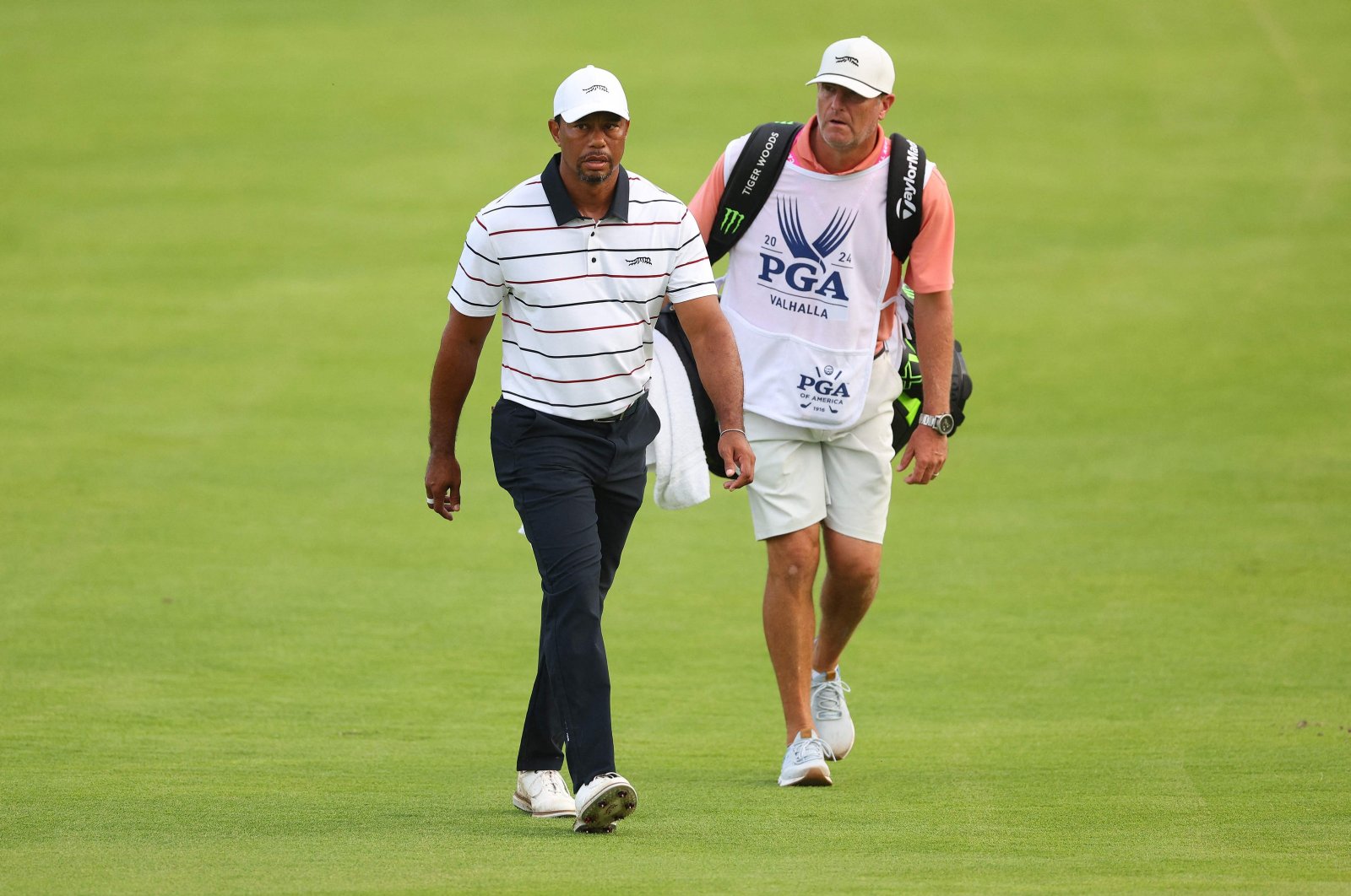 Tiger Woods and his caddie, Lance Bennett, walk the 18th fairway during the second round of the 2024 PGA Championship at Valhalla Golf Club, Louisville, Kentucky, U.S., May 17, 2024. (AFP Photo)