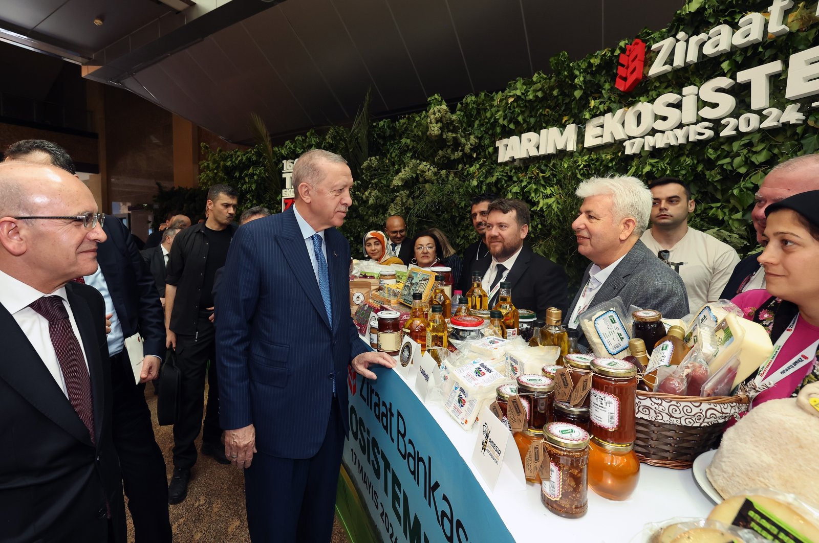 President Recep Tayyip Erdoğan chats with farmers during a program in western Bilecik province, Türkiye, May 17, 2024. (IHA Photo)