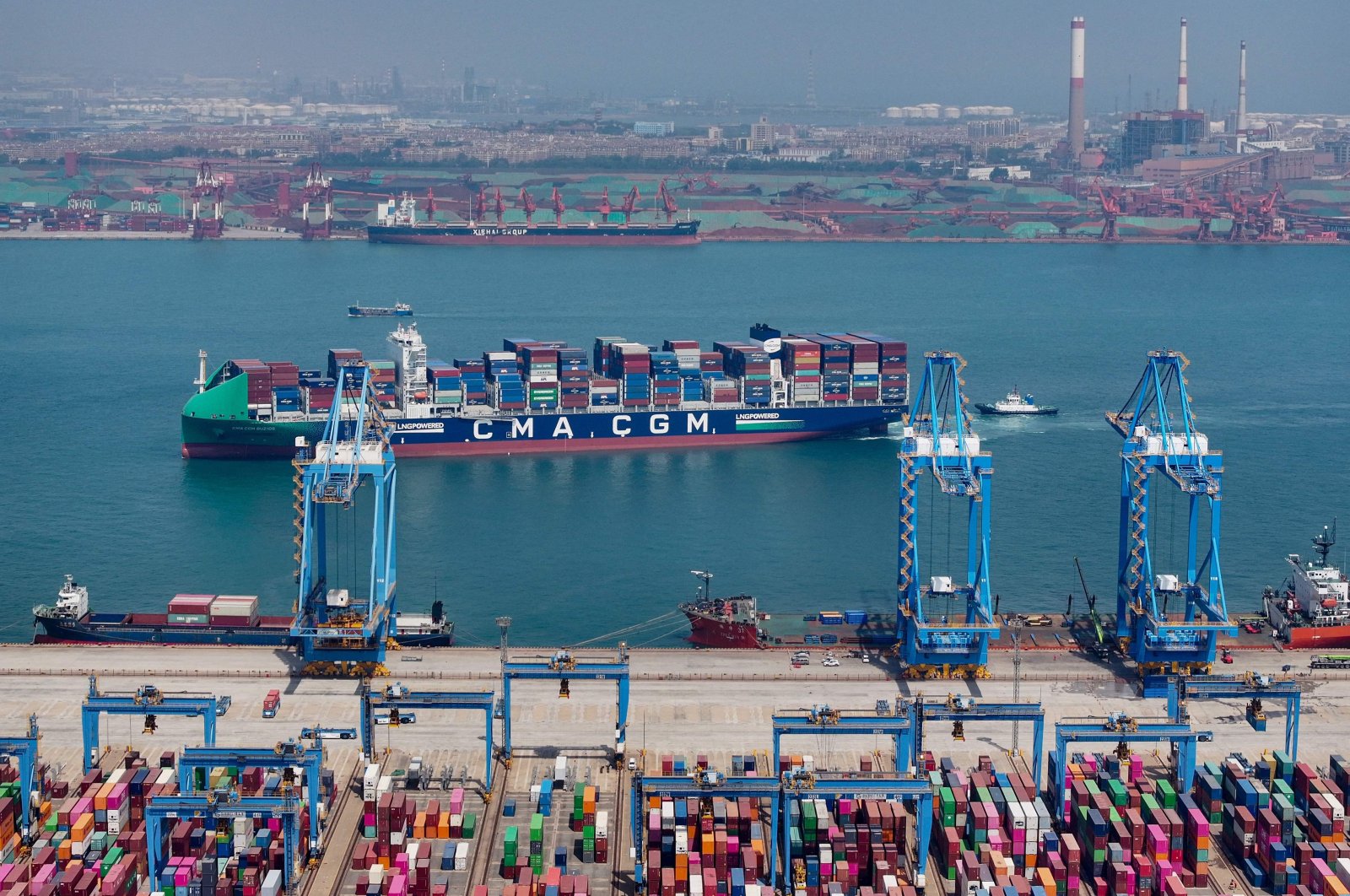 This aerial photograph taken shows a cargo ship loaded with containers at a port in Qingdao, eastern Shandong province, China, May 14, 2024. (AFP Photo)