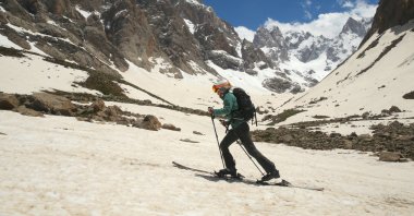 Athletes enjoy mountain skiing and snowboarding at the foot of the Cilo Mountains, Hakkari, Türkiye, May 19, 2024. (AA Photos)