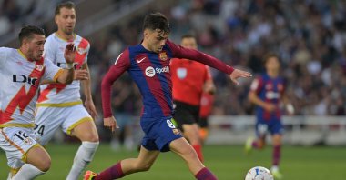 Barcelona&#039;s Pedri kicks the ball and scores his team&#039;s third goal during the La Liga match against Rayo Vallecano at the Estadi Olimpic Lluis Companys, Barcelona, Spain, May 19, 2024. (AFP Photo)