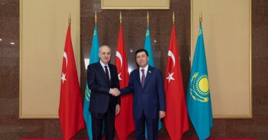 Parliament Speaker Numan Kurtulmuş (L) shakes hands with Erlan Qoshanov, Astana, Kazakhstan, May 20, 2024. (AA Photo)