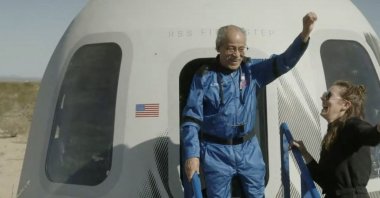 This screen grab taken from a Blue Origin broadcast shows Ed Dwight celebrating as he exits the Mission NS-25 crew capsule, upon landing near the Blue Origin base near Van Horn, Texas, U.S., May 19, 2024. (AFP Photo)