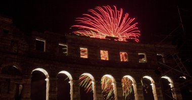Fireworks marking the opening ceremony of an international film festival illuminate the Roman amphitheater, Pula, Croatia, July 21, 2012. (AP Photo)