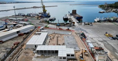 This aerial photograph shows a view of the construction site of a holding center for migrants rescued in Italian waters in the port of Shengjin, some 60 km northwest of the capital Tirana, on May 2, 2024. (AFP Photo)