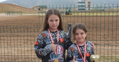 Turkish sisters Melisa (L) and Mimoza Mete pose for a photo at the Afyonkarahisar Motorsports Center, Afyonkarahisar, Türkiye, May 21, 2024. (AA Photo)