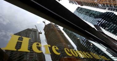 The construction site of the &quot;4 Frankfurt&quot; skyscraper is reflected in a shop window, Frankfurt, Germany, July 19, 2023. (Reuters Photo)