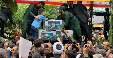 People attend a funeral ceremony for the victims of a helicopter crash that killed Iranian President Ebrahim Raisi in Tabriz, East Azerbaijan Province, Iran, May 21, 2024. (AA Photo)