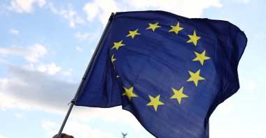 A participant displays the flag of the European Union during a demonstration against the far right and to condemn attacks on politicians, in front of the Brandenburg Gate, Berlin, Germany, May 5, 2024. (AFP Photo)