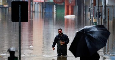 A man walks in a flooded street in Porto Alegre, Rio Grande do Sul state, Brazil, May 16, 2024. (Reuters Photo)
