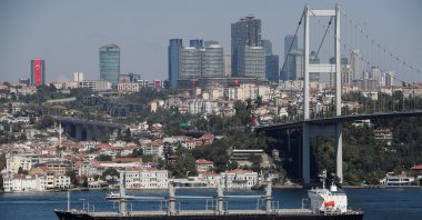 A bulk carrier transits Bosporus on its way to the Mediterranean Sea with skyscrapers in the background in Istanbul, Türkiye, Aug. 29, 2023. (Reuters Photo)