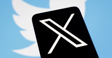 The logo for social media platform X, following the rebranding of Twitter, is seen covering the old logo in this illustration taken on July 24, 2023. (Reuters File Photo)