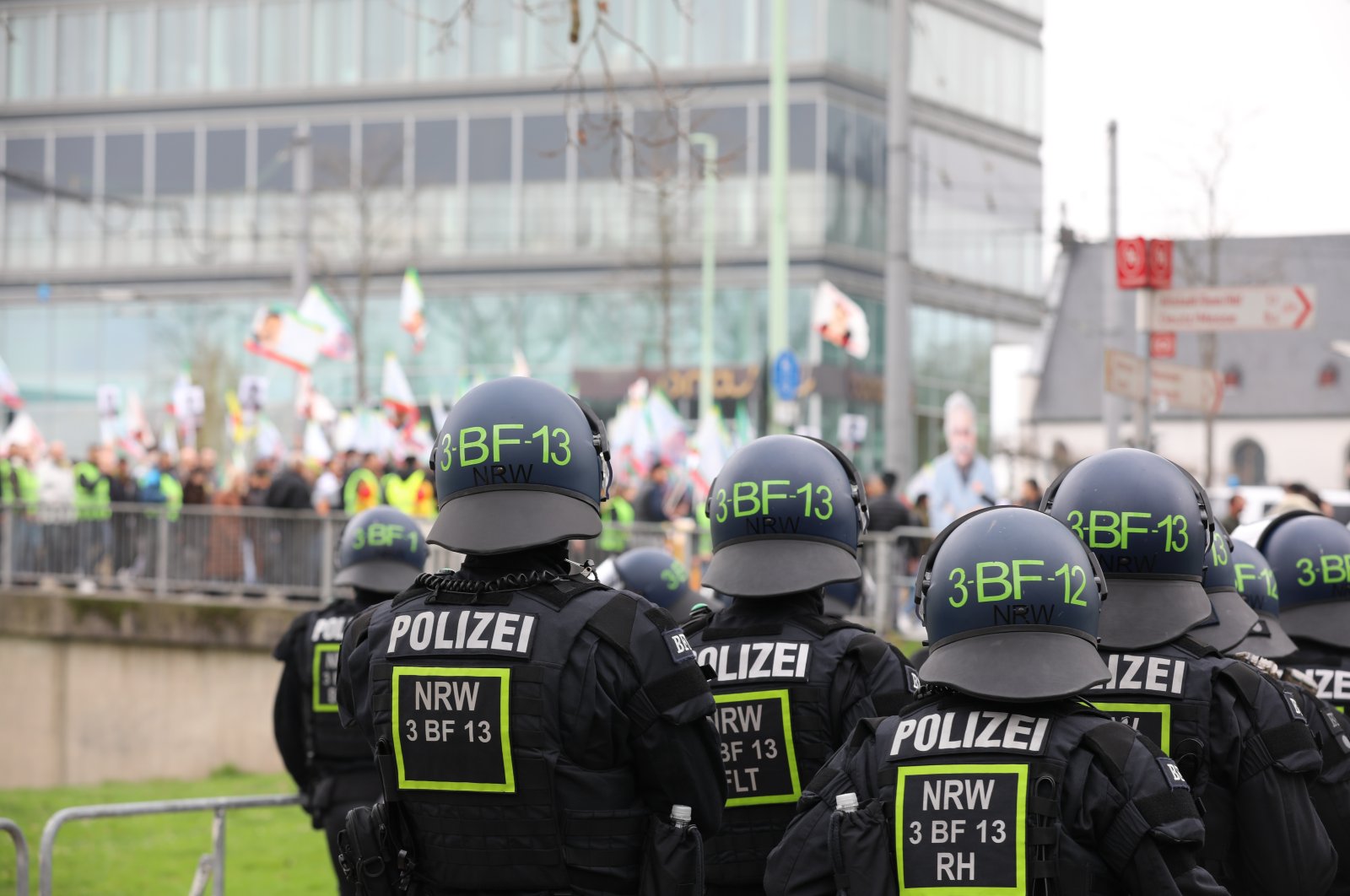 Police officers watch a demonstration by supporters of the PKK terrorist group, Cologne, Germany, Feb. 17, 2024. (Reuters Photo)