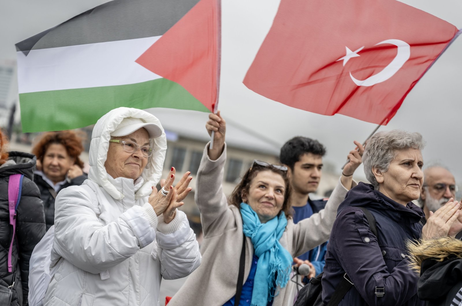 Pro-Palestinian protester hold the Palestinian and Turkish flag in Istanbul, Türkiye, May 11, 2024. (AA Photo)