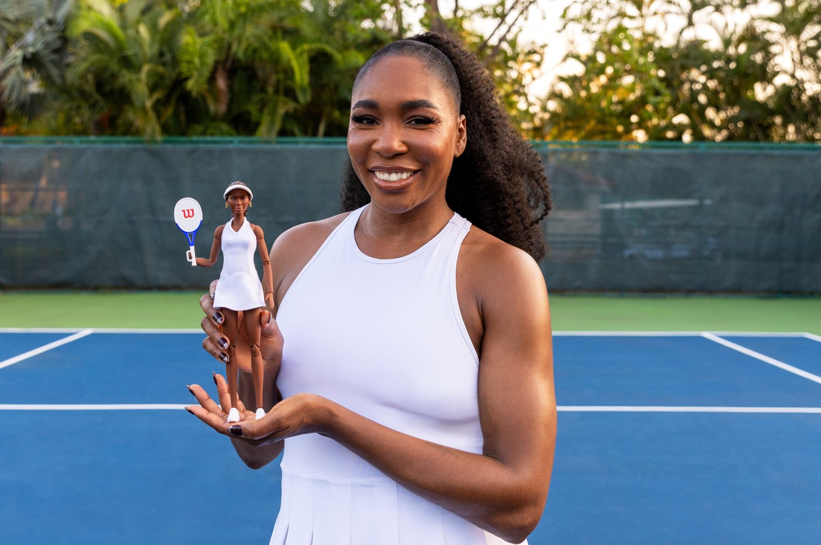 Undated photo shows U.S. Tennis Player Venus Williams poses with a Barbie doll, Puerto Rico. (Reuters Photo)