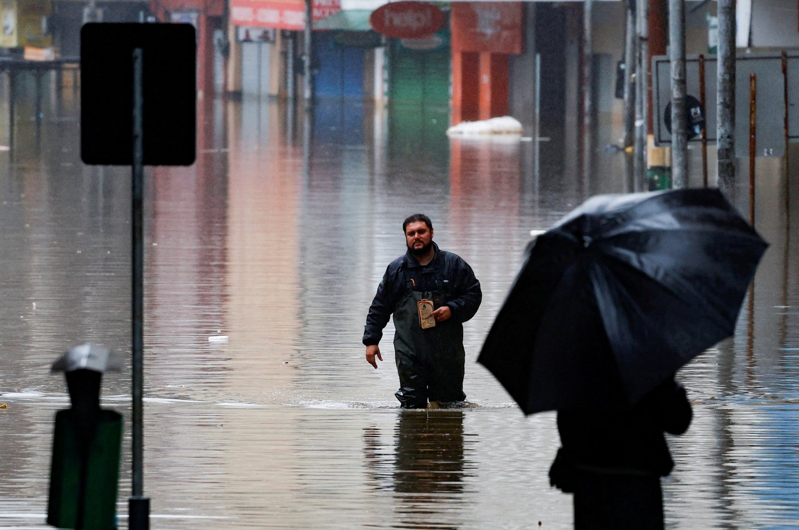 A man walks in a flooded street in Porto Alegre, Rio Grande do Sul state, Brazil, May 16, 2024. (Reuters Photo)