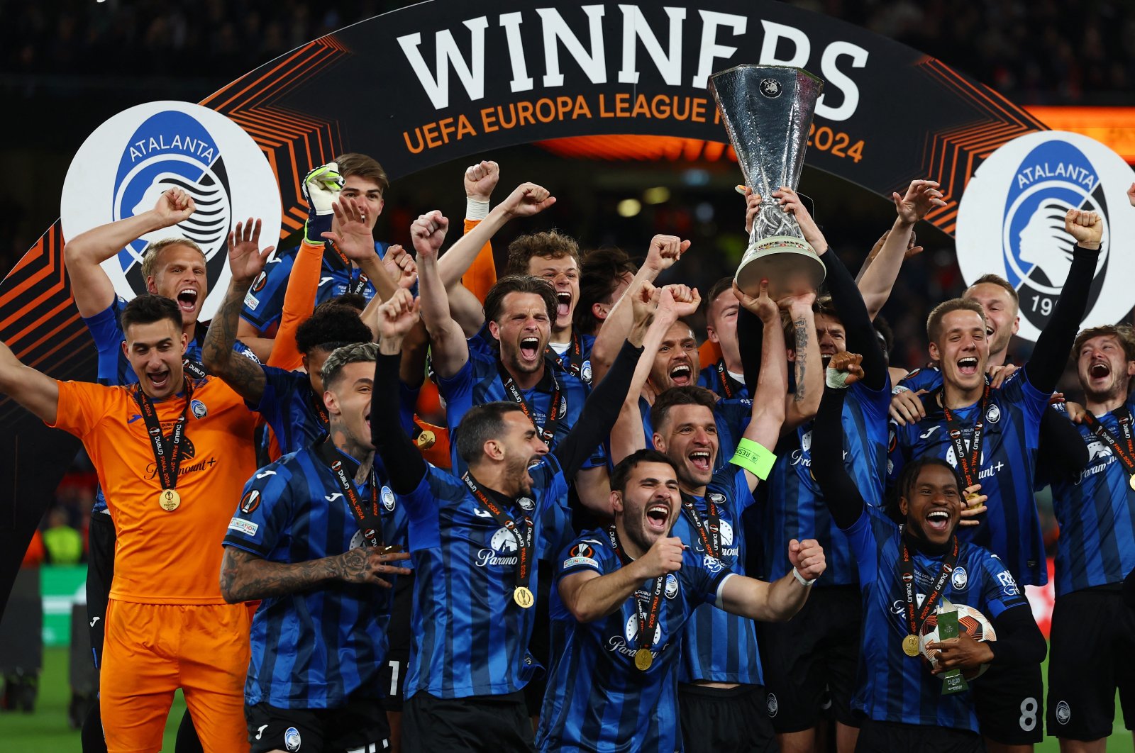 Atalanta&#039;s Berat Djimsiti lifts the trophy as he celebrates with teammates after winning the Europa League against Bayer Leverkusen, Aviva Stadium, Dublin, Ireland, May 22, 2024. (Reuters Photo)