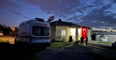 An ambulance waits outside the family home of the late soldier in Iğdır, eastern Türkiye, May 23, 2024. (İHA Photo)