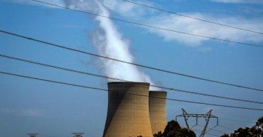 This photo shows electricity lines near emission funnels for the Bayswater coal-powered thermal power station located near the central New South Wales town of Muswellbrook, Australia, Dec. 13, 2023. (AFP Photo)