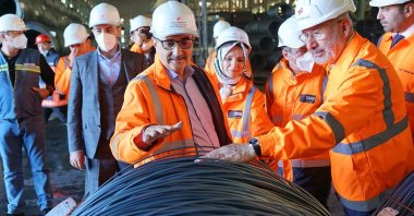 Fuat Tosyalı (R), chairperson of the board of directors of Tosyalı Holding, Türkiye's then-Ambassador to Algeria Mahinur Özdemir Göktaş (C) and then-Energy and Natural Resources Minister Fatih Dönmez visit Tosyalı Holding's factory in Algeria in this undated photo from 2019. (Tosyalı Steel Photo)
