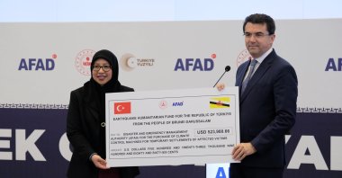 Ambassador-Designate of Brunei Darussalam Noni Zurainah Ismi and Okay Memiş, head of the Disaster and Emergency Management Authority (AFAD), are seen during a donation ceremony, Ankara, Türkiye, May 22, 2024. (DHA Photo)
